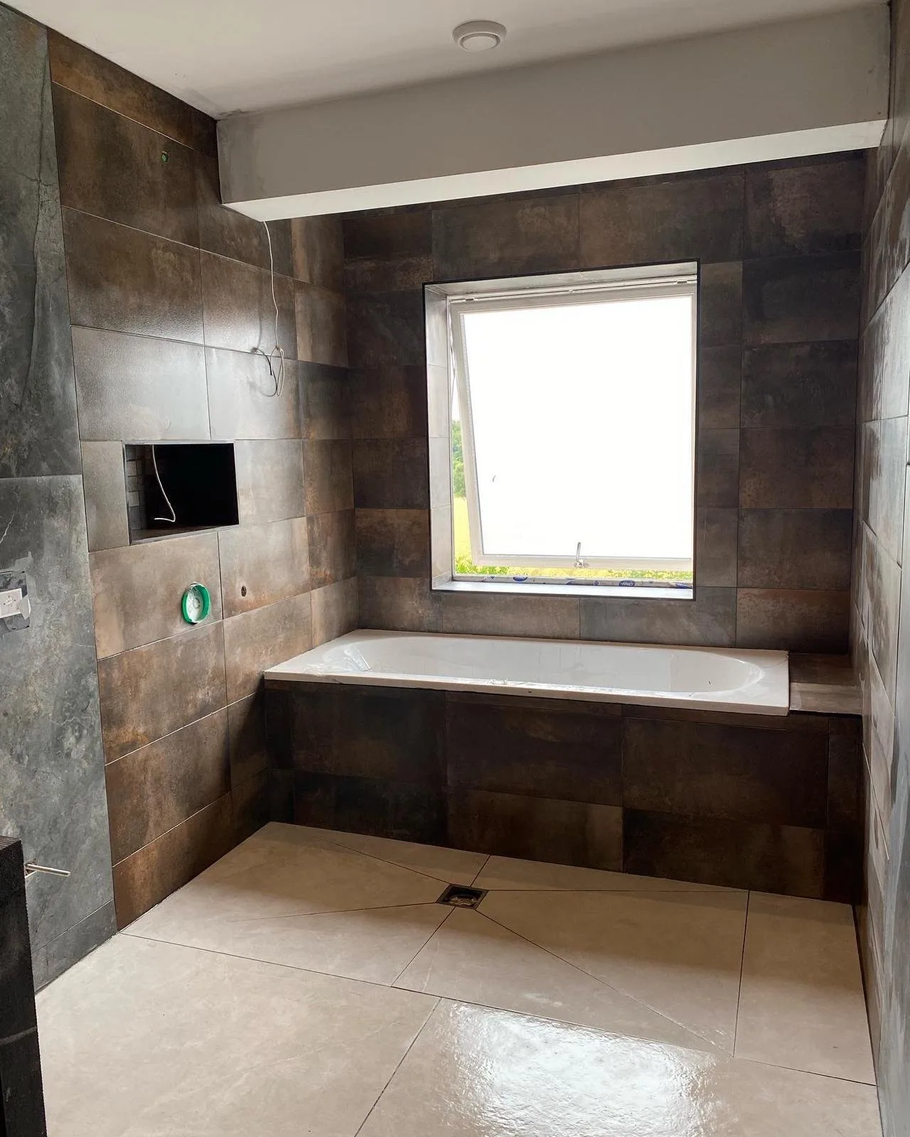 Tiled bathroom with fitted bath